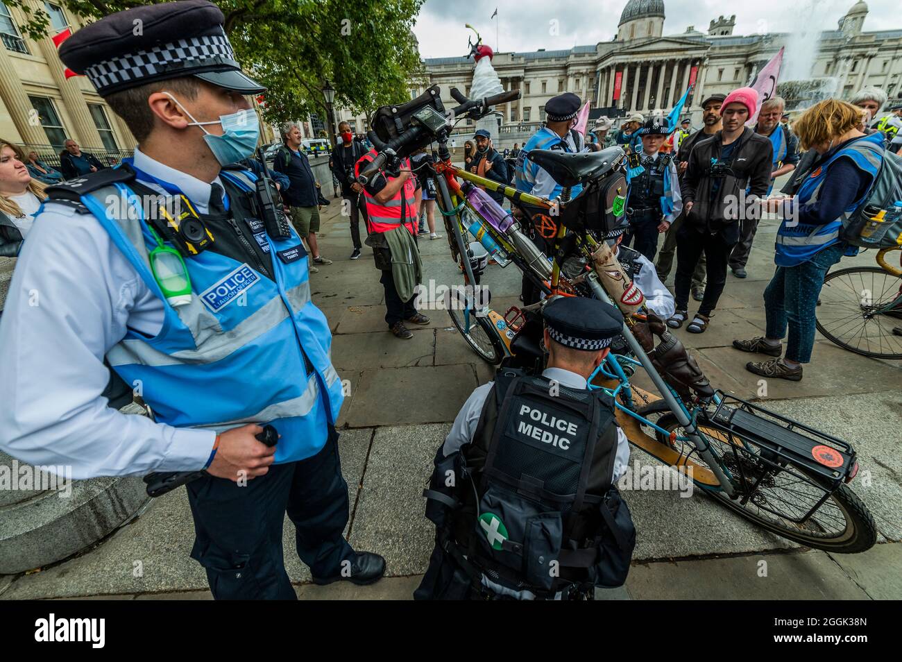London, UK. 1st Sep, 2021. AA rebels bike is searched for glue - Extinction Rebellion continues its two weeks with a Greenwash protest ending in Trafalgar Square, under the overalll Impossible Rebellion name. Credit: Guy Bell/Alamy Live News Stock Photo
