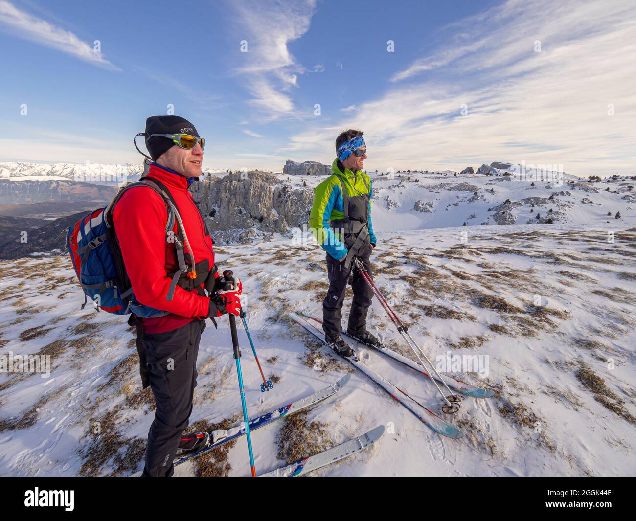 Two skiers on a ski tour with pulka material sledges through the nature reserve Réserve naturelle des Hauts Plateaux du Vercors Stock Photo
