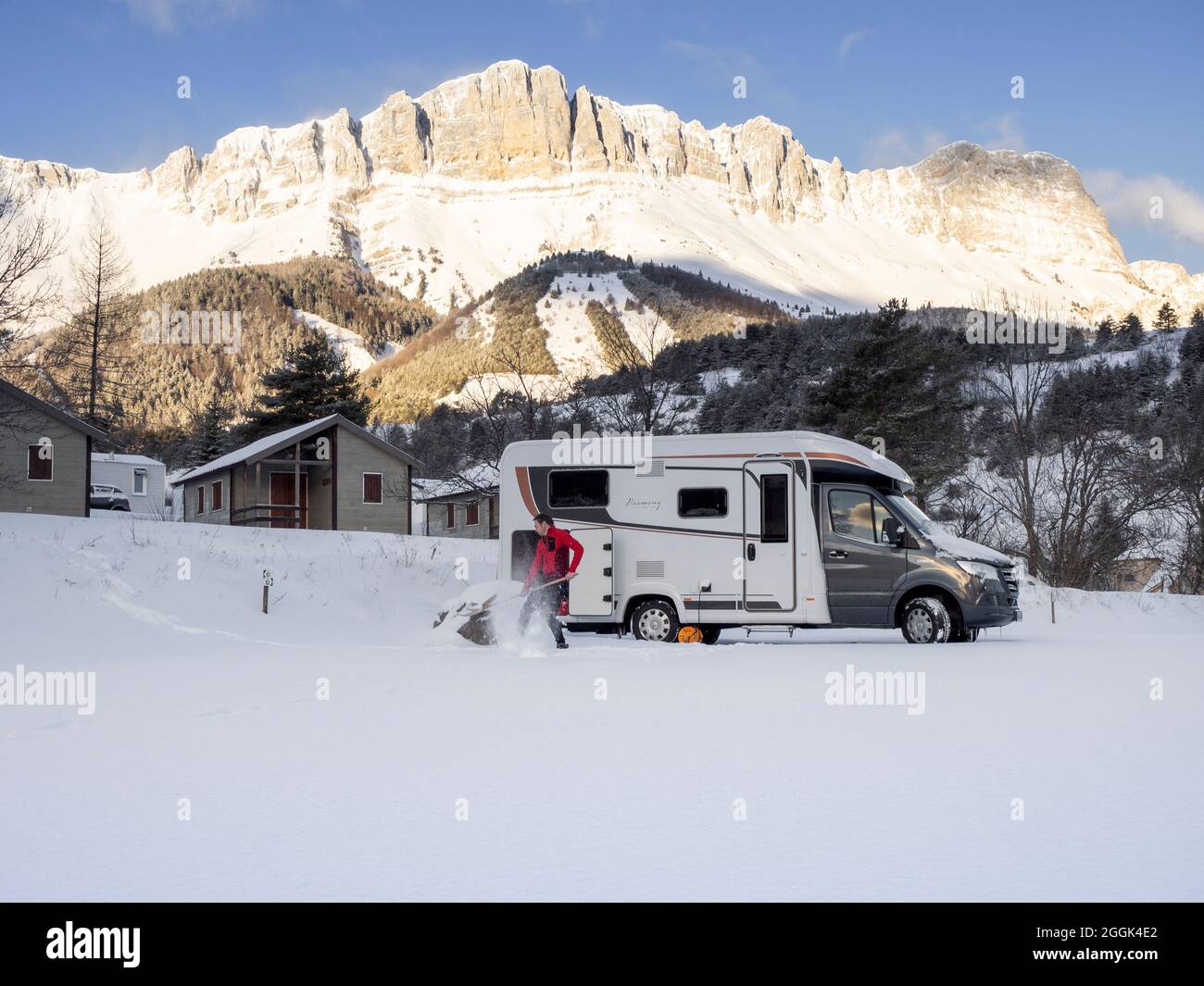Winter camping with the motorhome. Gresse-en-Vercors, with the Grand Veymont in the background Stock Photo