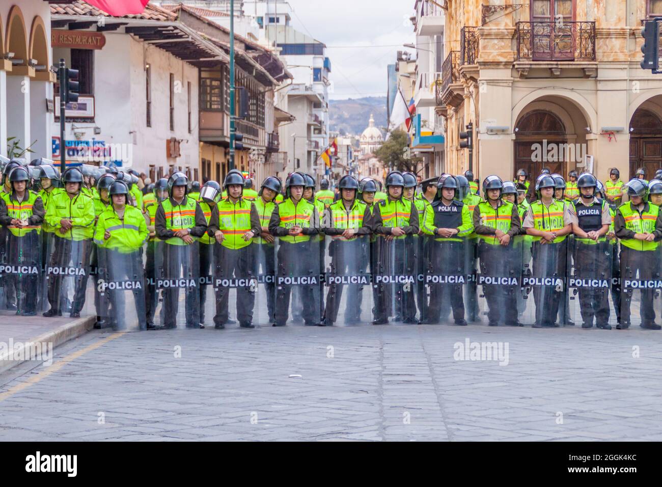 CUENCA, ECUADOR - JUNE 17, 2015: Lined police in the center of Cuenca, Ecuador Stock Photo