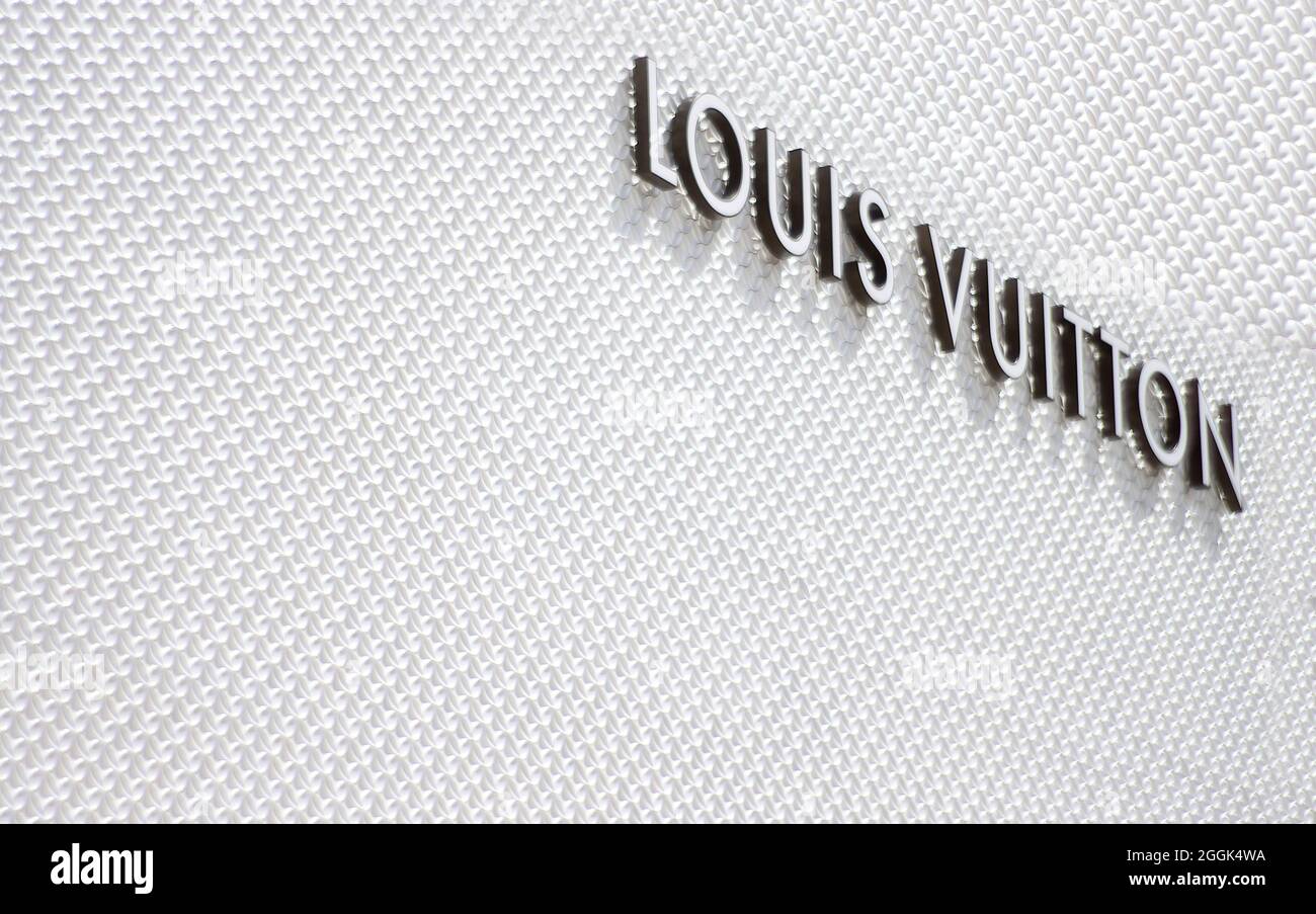 Kyiv, Ukraine. March 3, 2020. Louis Vuitton famous monogram. Multicolored  logo printed on knitted synthetic black fabric. Luxury brand backgrounds  and Stock Photo - Alamy