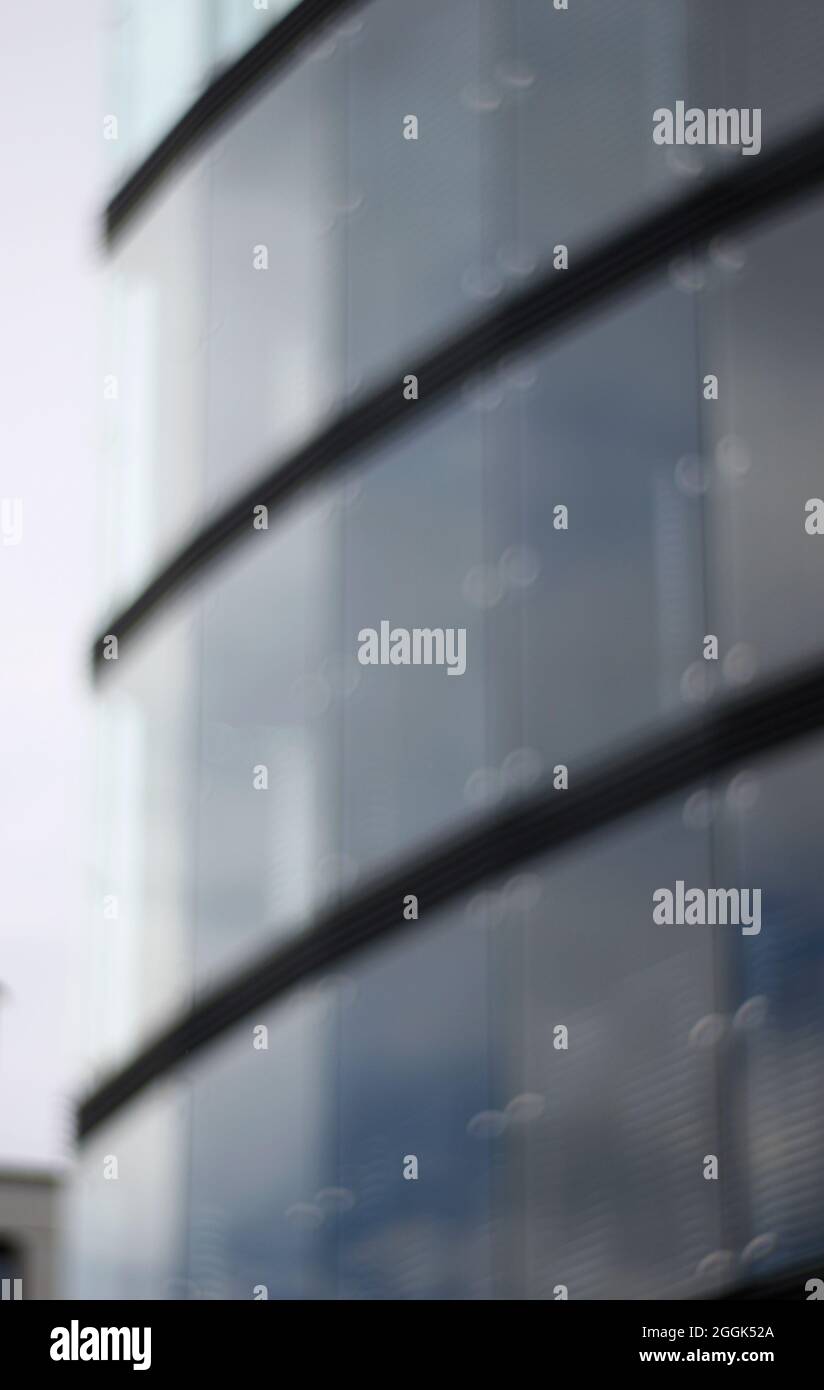 Glass facade of a commercial building Stock Photo - Alamy