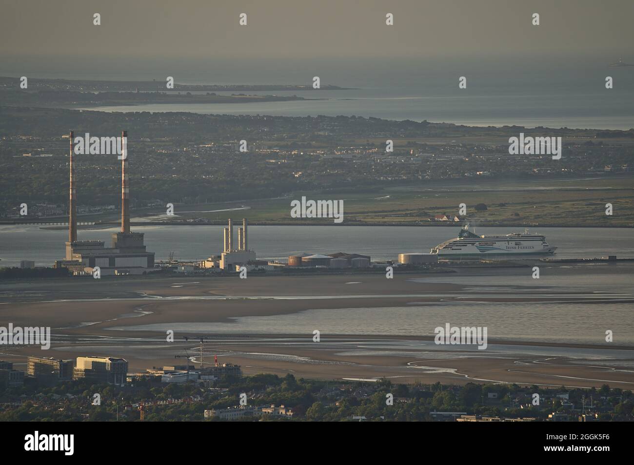 Dublin, Ireland-June 11, 2021: Beautiful closeup aerial view of Poolbeg CCGT chimneys, Pigeon House Power Station and Irish Ferries seen from Ticknock Stock Photo