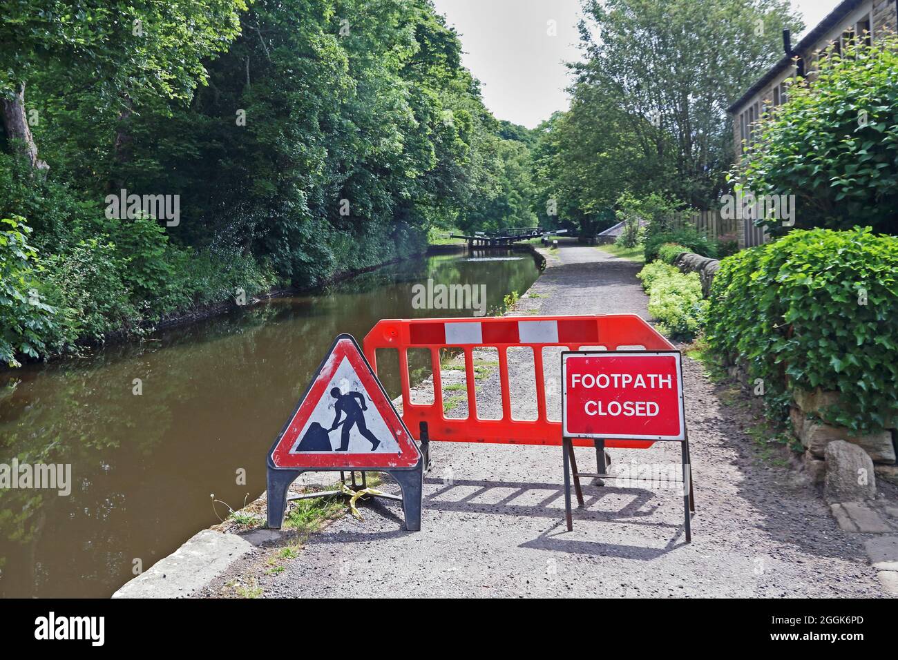 Signs and barrier blocking access to Rochdale Canal Stock Photo