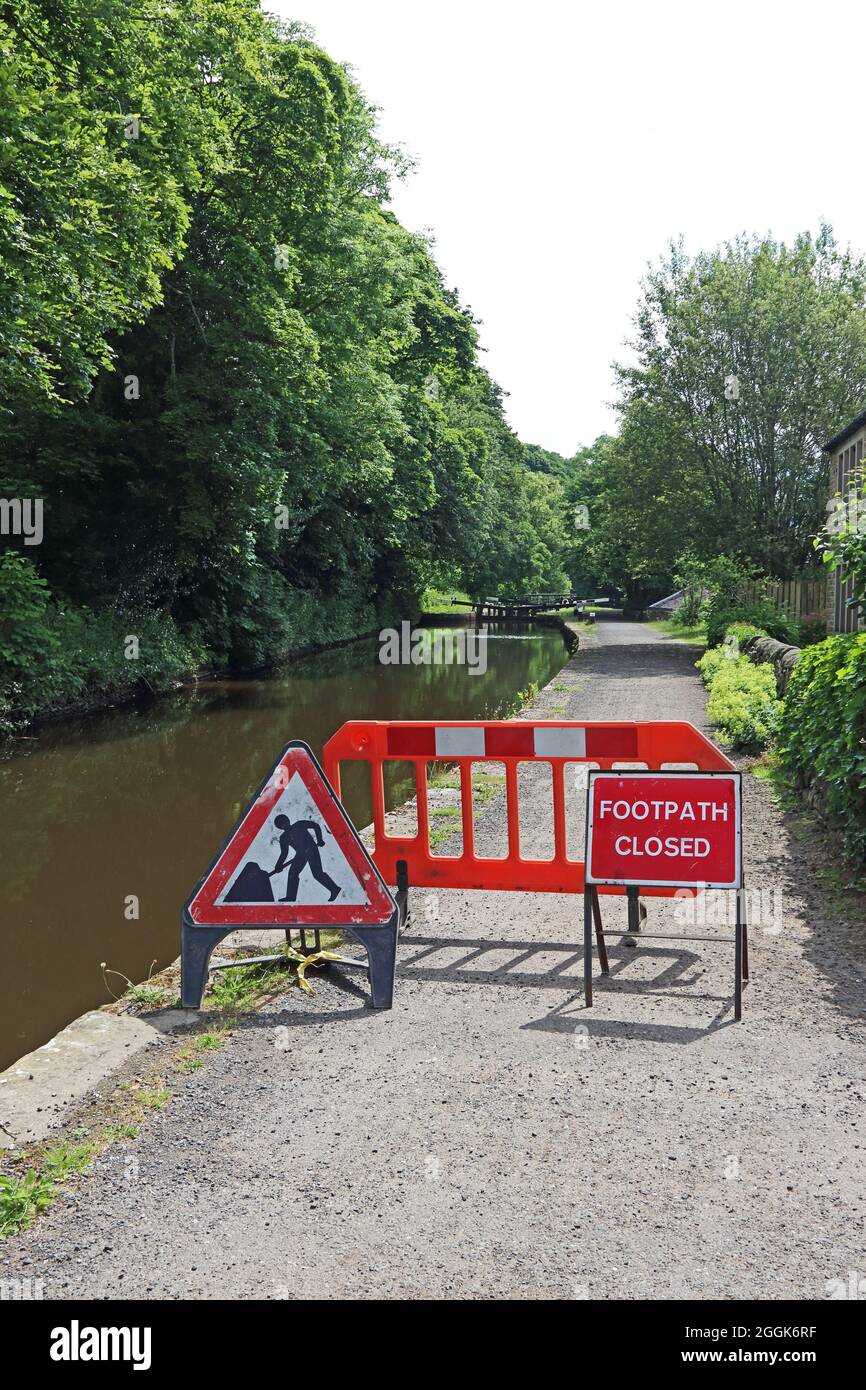 Signs and barrier blocking access to Rochdale Canal Stock Photo