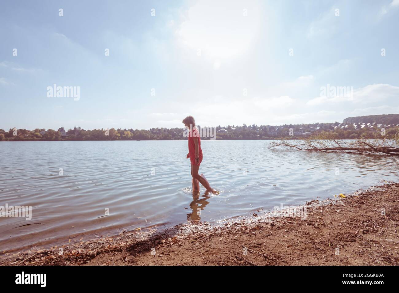 adorable happy girl in wellington boots standing in the river Stock ...