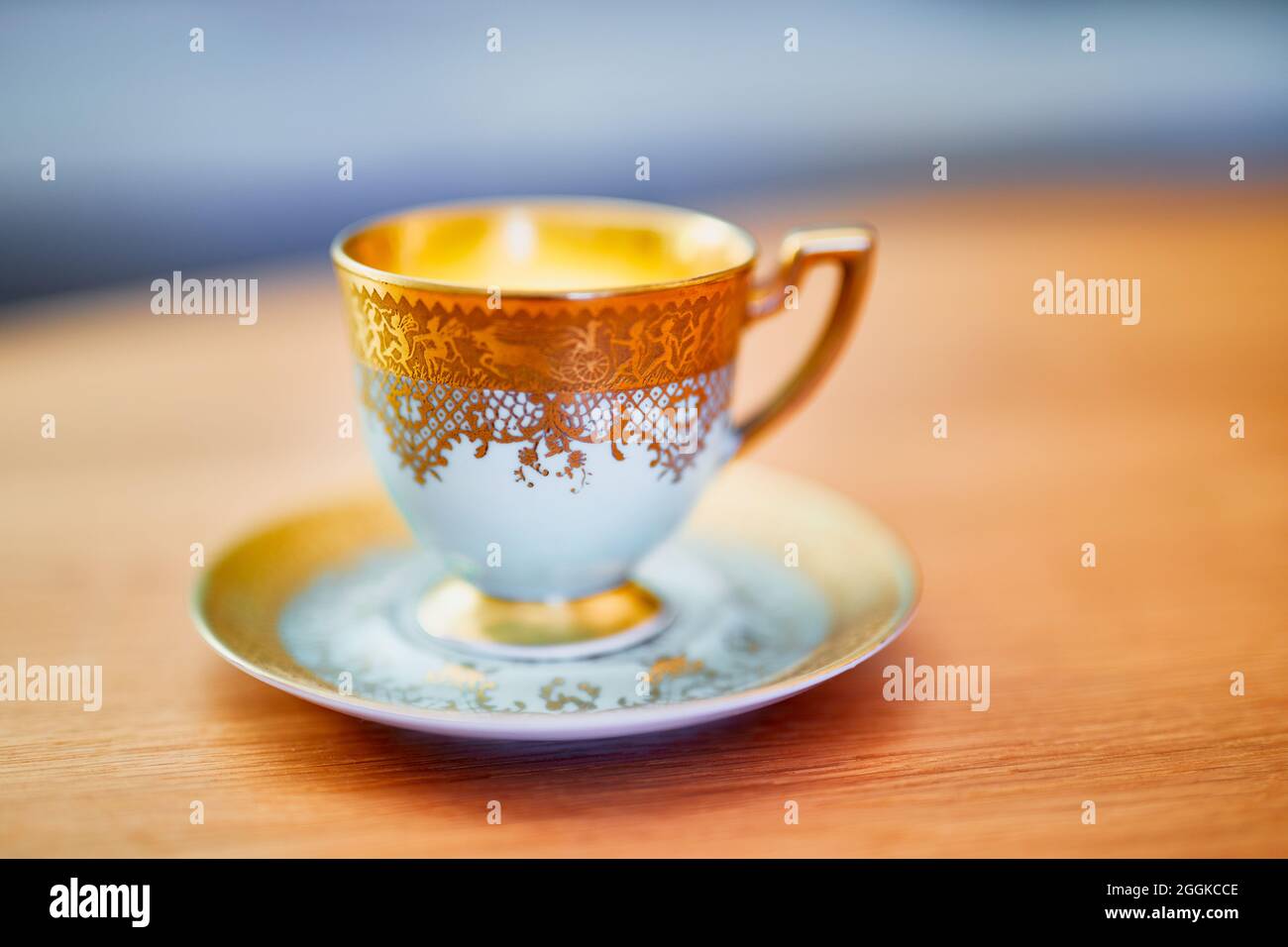 Coffee cup with gold decoration Stock Photo