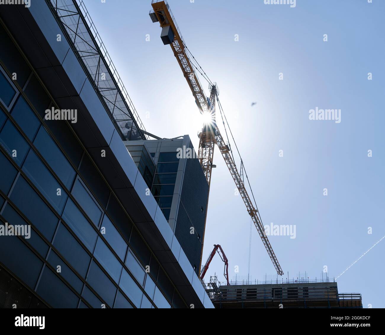 Construction site with tower crane for lifting building materials and ...