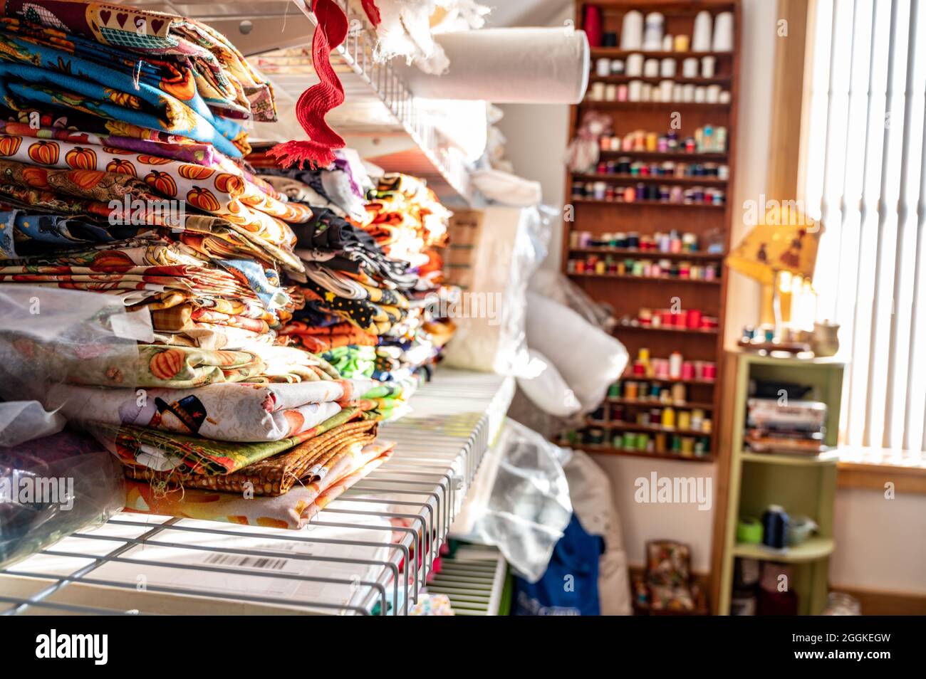 Assorted pile of fabric and bolts of cloth Stock Photo Alamy
