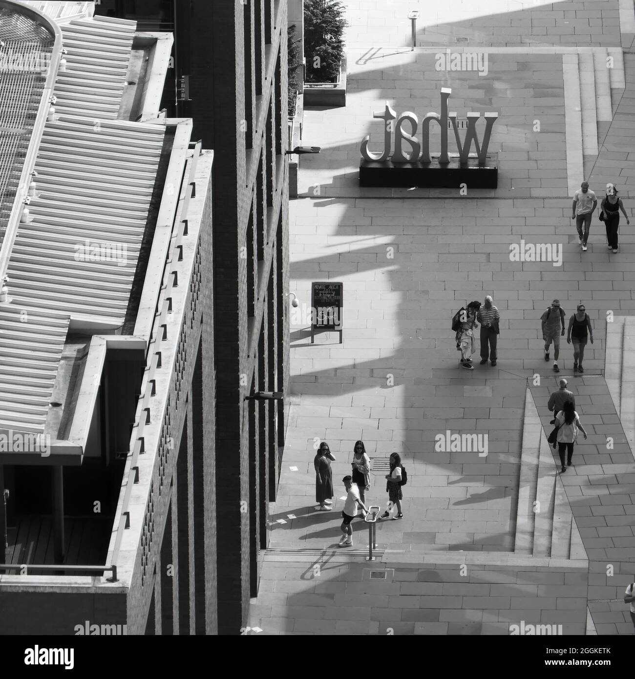 London, Greater London, England, August 24 2021: Aerial black and white image of groups of people walking and socialising on a walkway near St Pauls C Stock Photo