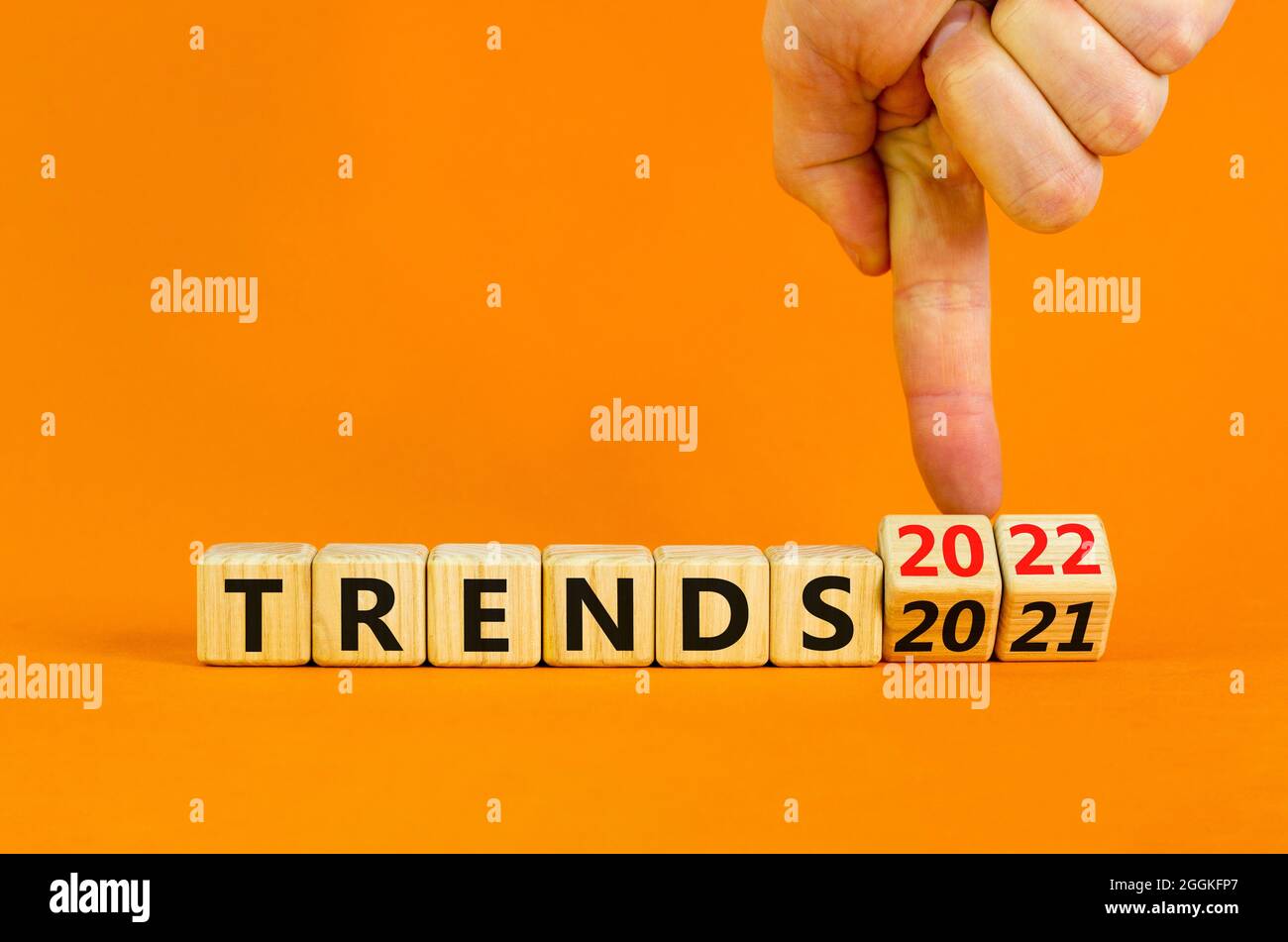 2022 Trends New Year Symbol Businessman Turns Wooden Cubes And Changes Words Trends 2021 To Trends 2022 Beautiful Orange Background Copy Space Stock Photo Alamy New Year 2022 Trends