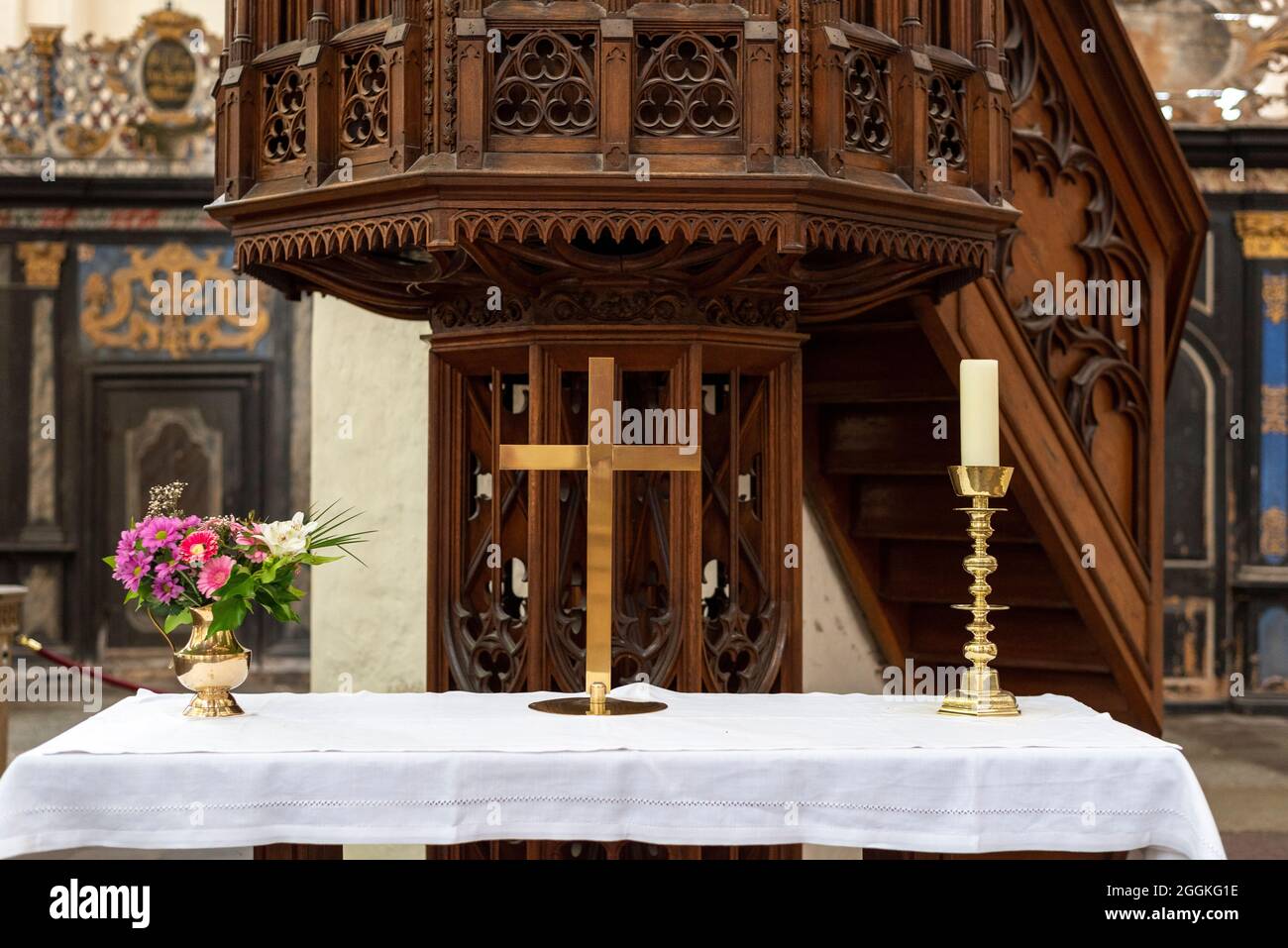 Germany, Mecklenburg-Western Pomerania, Stralsund, a cross stands in front of a pulpit in the Marienkirche in the Hanseatic city of Stralsund, Baltic Sea Stock Photo
