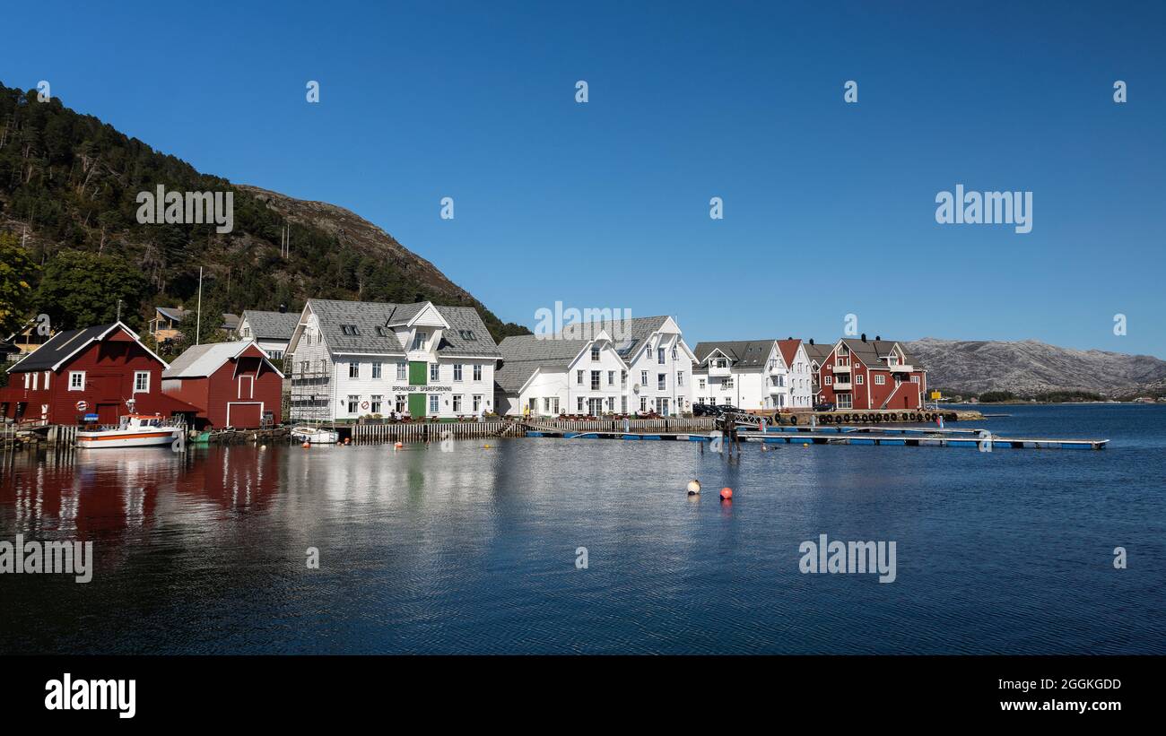 Kalvåg harbour with Knutholmen at Frøya, Nordfjord is a former fisher village turned tourist magnet Stock Photo