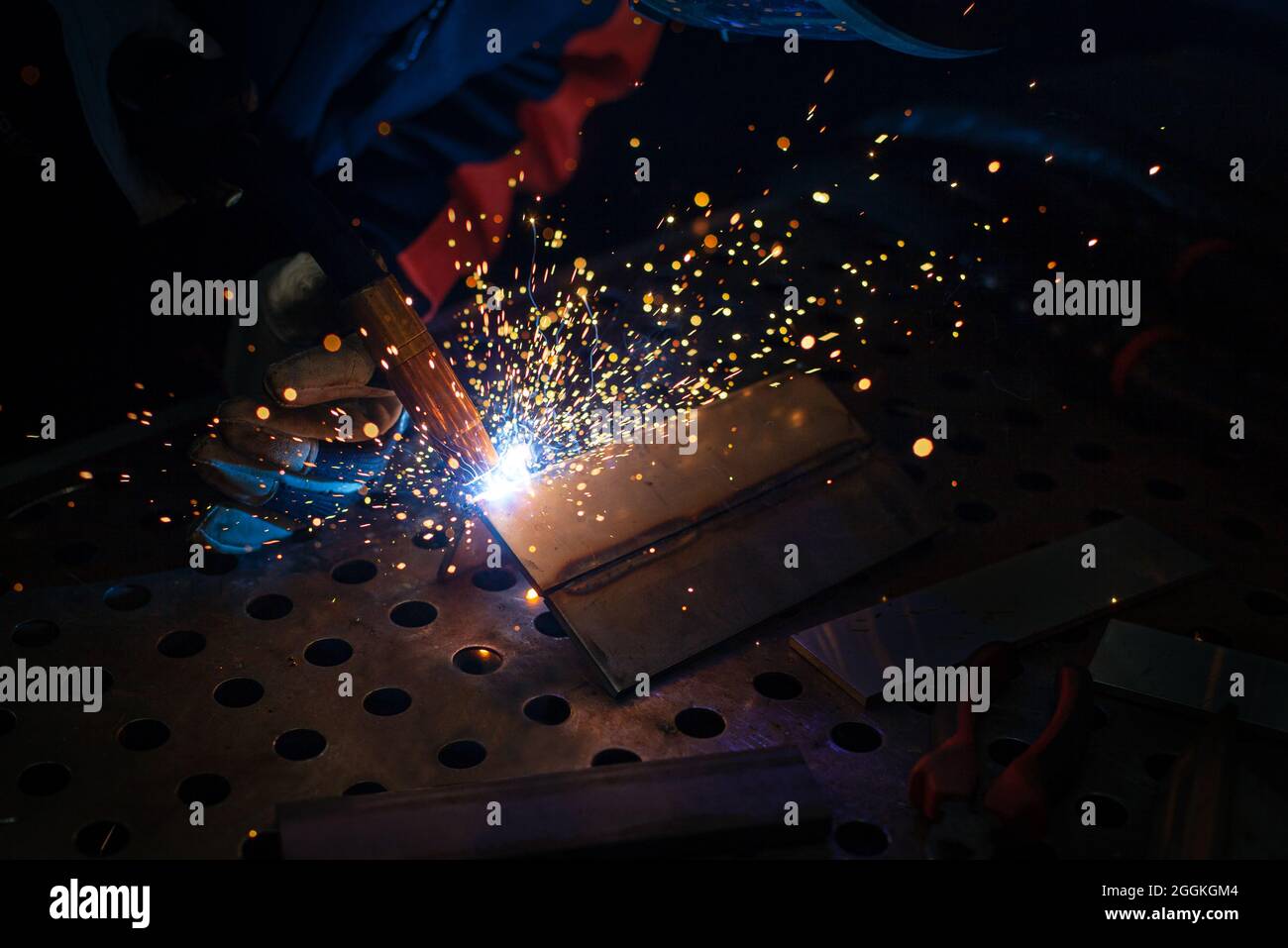 Close-up, metal structure welding. Semi-automatic manual welding. MIG welding. Stock Photo
