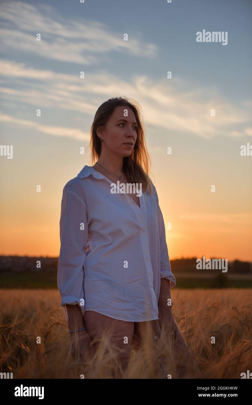 Aerial view of woman lying in the yellow field of wheat Stock Photo - Alamy