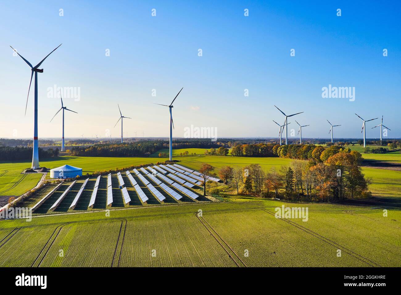 Energy industry, sustainability, wind energy and solar energy, aerial view of solar field and wind farm Stock Photo