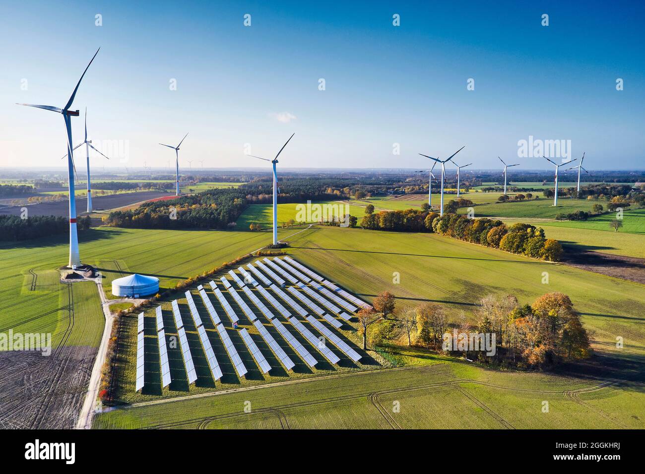 Energy industry, sustainability, wind energy and solar energy, aerial view of solar field and wind farm Stock Photo