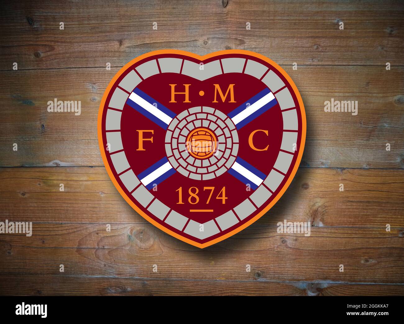 Coat of arms of FC Heart of Midlothian, Edinburgh, football club from Scotland, wooden background Stock Photo