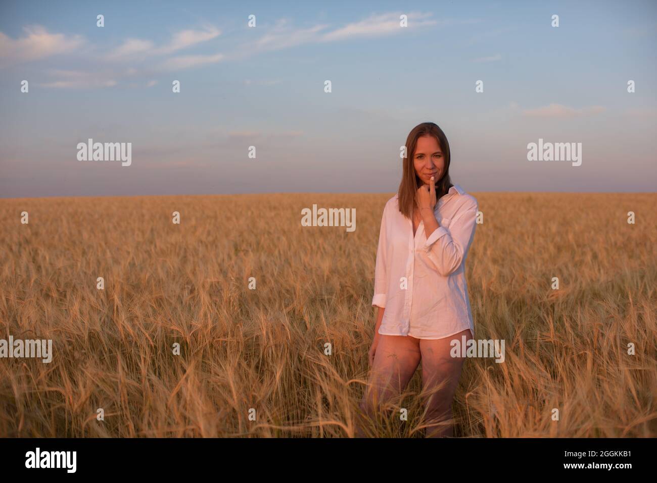 Aerial view of woman lying in the yellow field of wheat Stock Photo - Alamy