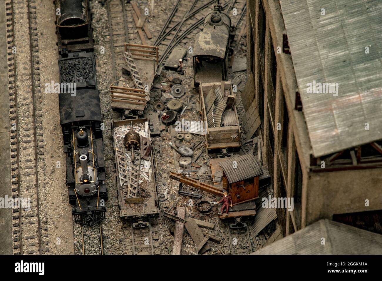 Overhead shot of a cluttered miniature train station with black ...