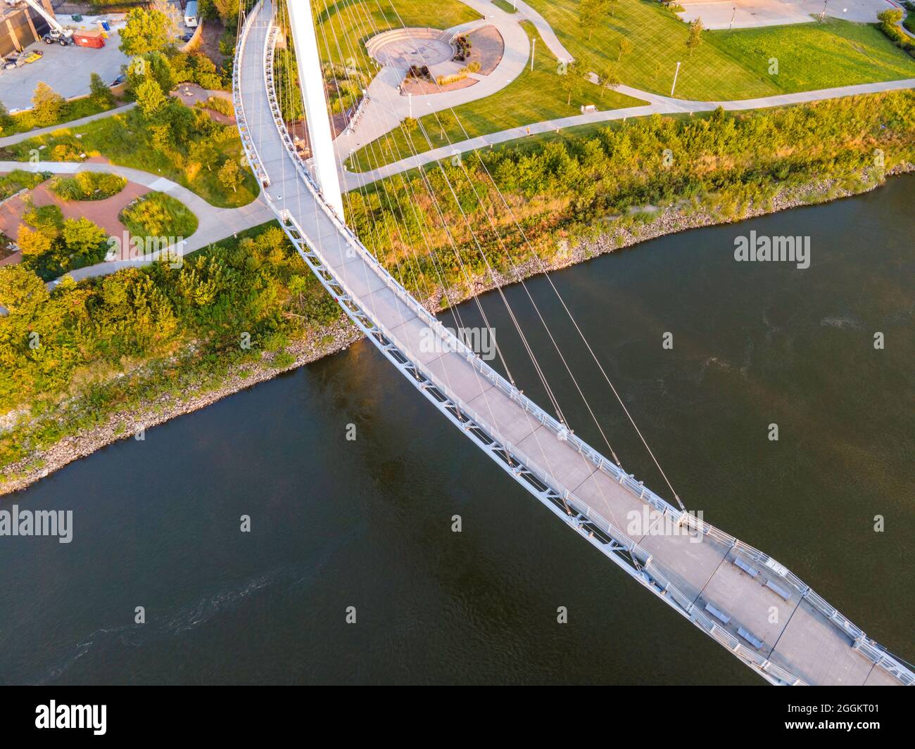 Aerial photograph of the Bob Kerrey Pedestrian Bridge that spans the Missouri River between Council Bluffs, Iowa and Omaha, Nebraska on a beautiful mo Stock Photo