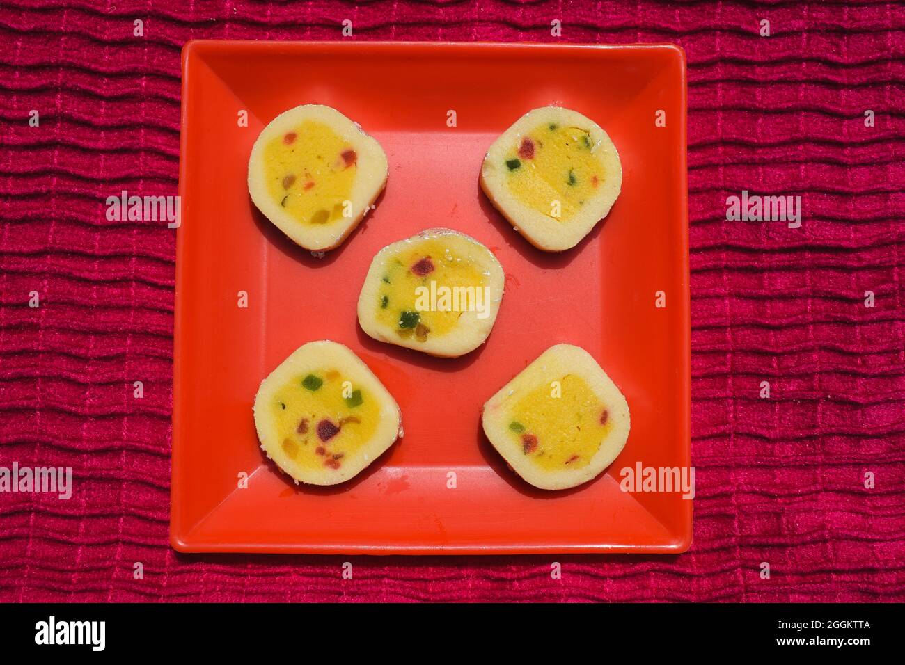 Indian sweet dish Tutti fruity Barfi rolls. With tutti frutti kesar flavour. Basically made of