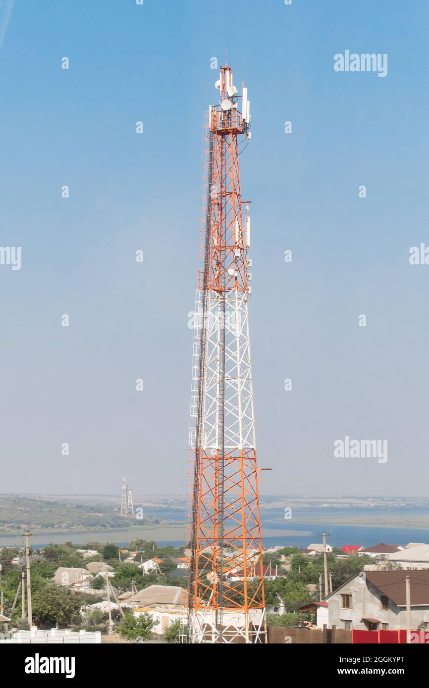 Radio global Internet tower of mobile communication telecommunication  against the background of blue sky Stock Photo - Alamy