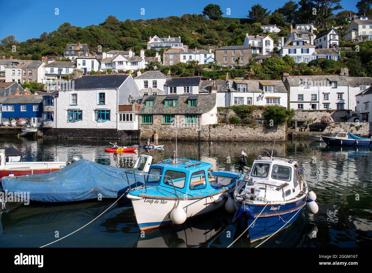 Polperro is a large village, civil parish, and fishing harbour within the Polperro Heritage Coastline in south Cornwall, England. Its population is ar Stock Photo