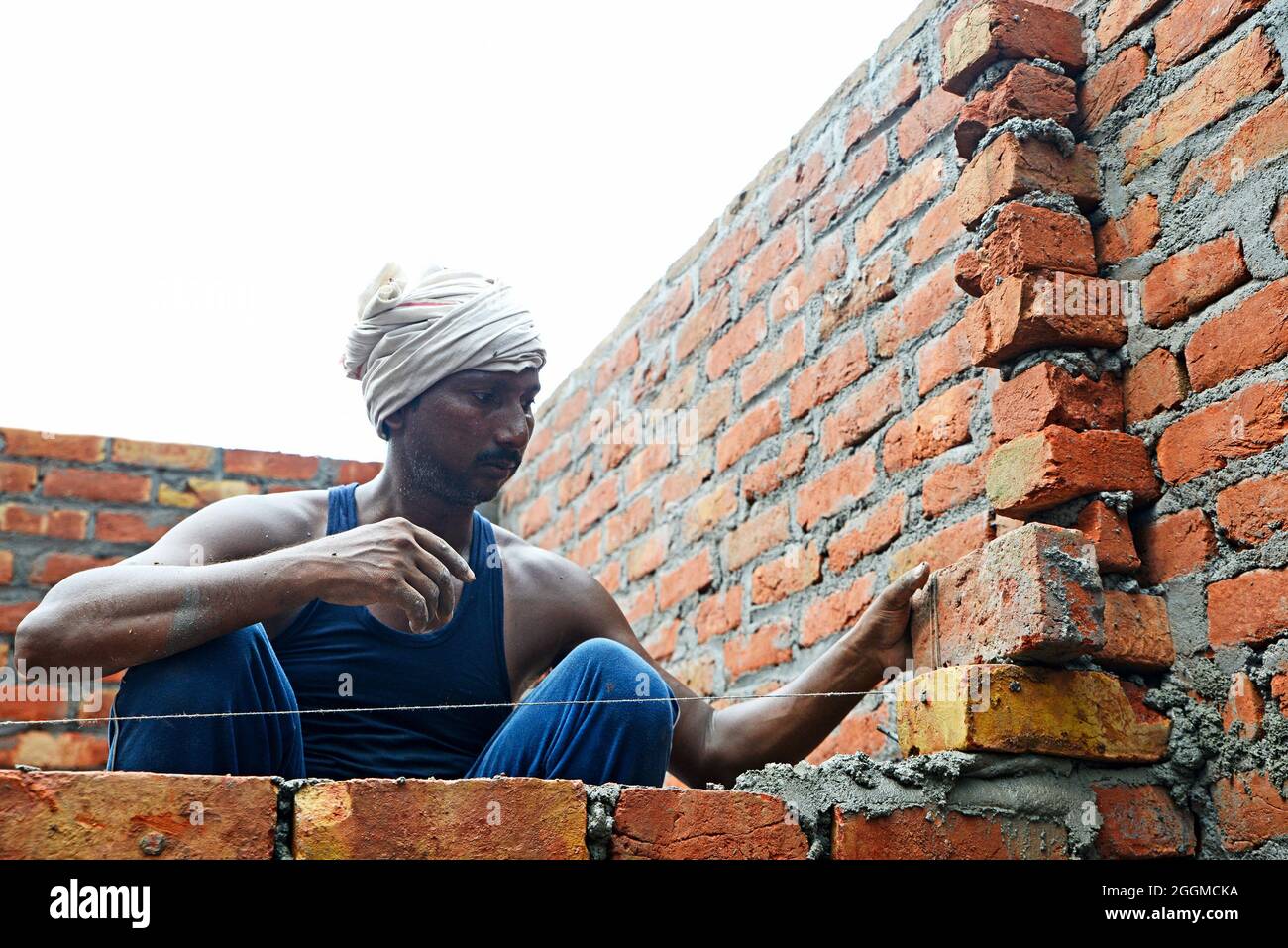 Manual Workers doing laborious job at a rural construction site in New