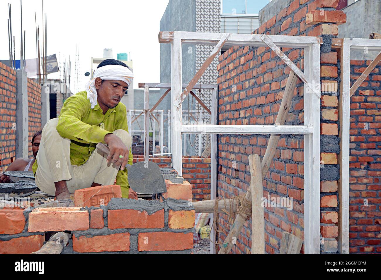 Manual Workers doing laborious job at a rural construction site in New