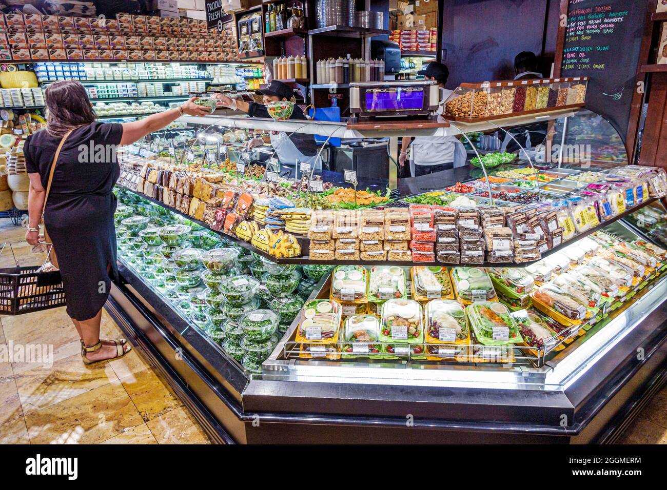 New York City,NY NYC Manhattan Chelsea,Westside Market gourmet grocery store food,deli sandwiches display sale woman female shopping shopper Stock Photo