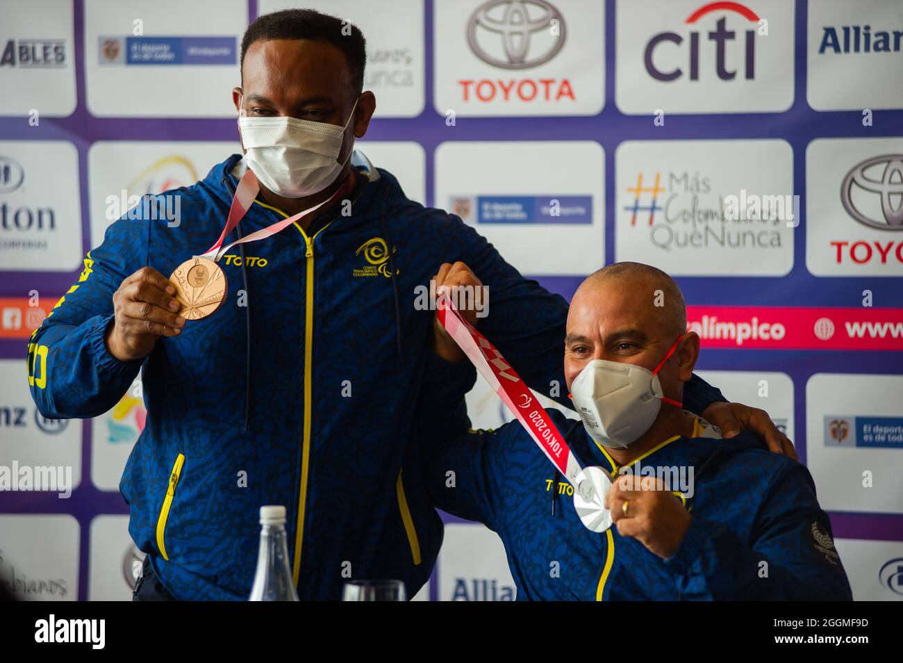 Fabian Torres (Left) and Moises Fuentes (Right) show their bronze and silver medals respectively during an event at Hilton Corferias Hotel after Paralympic Medallists Fabio Torres parapowerlifting bronze medal and Moises Fuentes 100 meter swiming silver medal arrived to Colombia after their participation in the Tokyo 2020+1 Paralympic Games. In Bogota, Colombia on September 1, 2021. Stock Photo