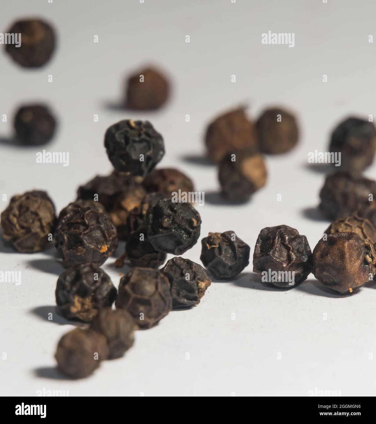 Fresh and Flavorful Whole Black Pepper Stock Photo