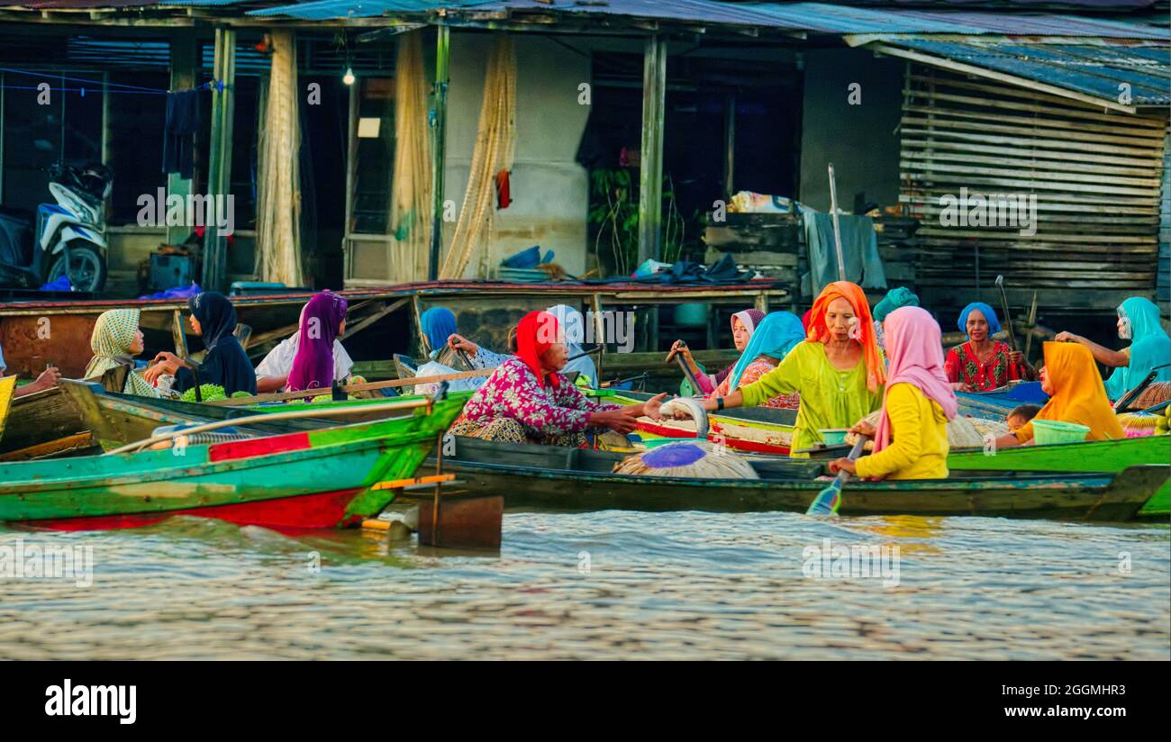 What makes Lok Baintan Floating Market more rare and unique is that the buyers usually pay in barter method. Rupiah is not a main currency exchange he Stock Photo