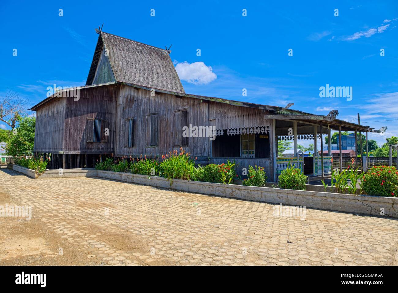 The Banjar house that uses Height Bubungan (Bubungan Tinggi) roof is called the Bubungan Tinggi House. This type of house is the highest value among o Stock Photo