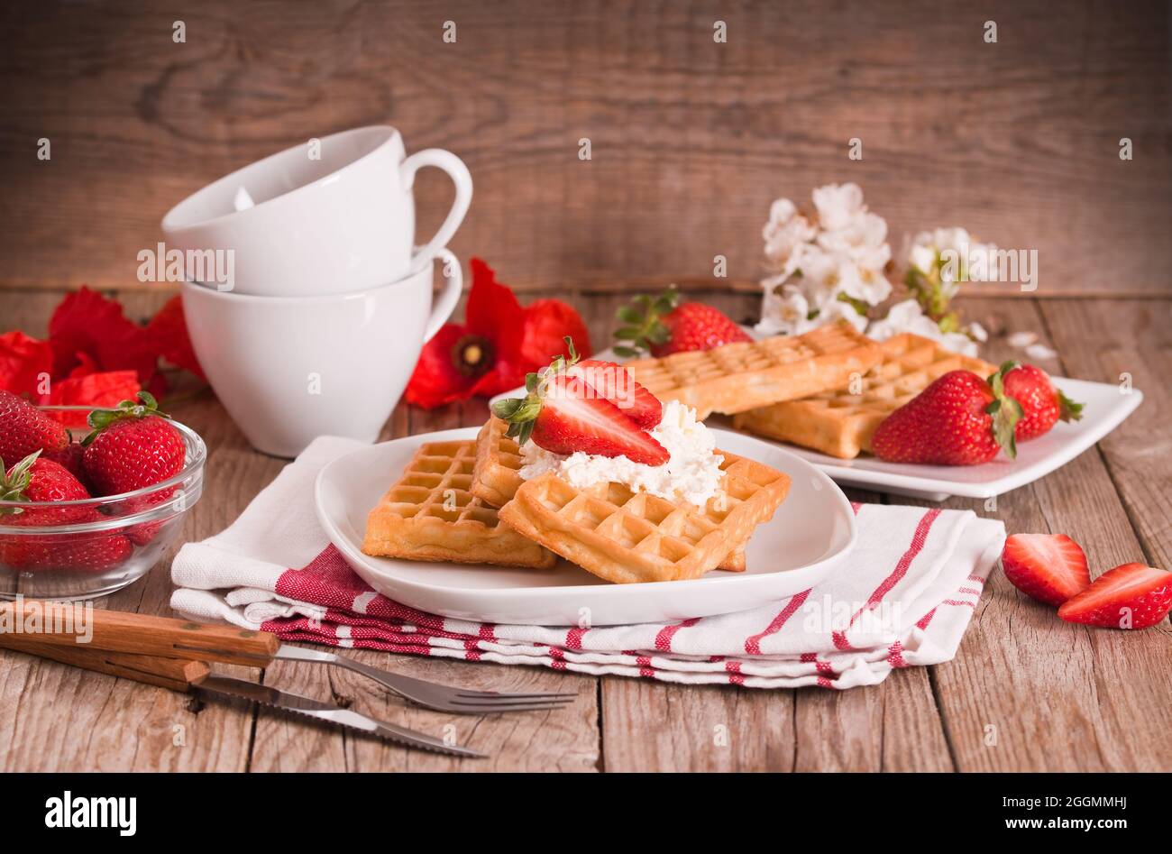 Waffles with strawberries and whipped cream Stock Photo - Alamy