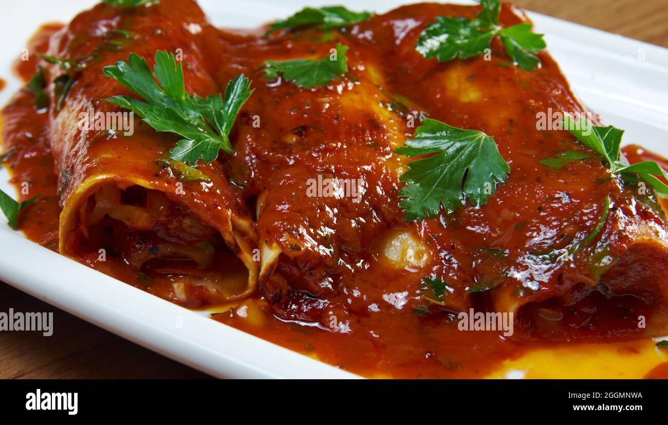 Beef Picadillo Enchiladas mixture on the bottom Stock Photo Alamy