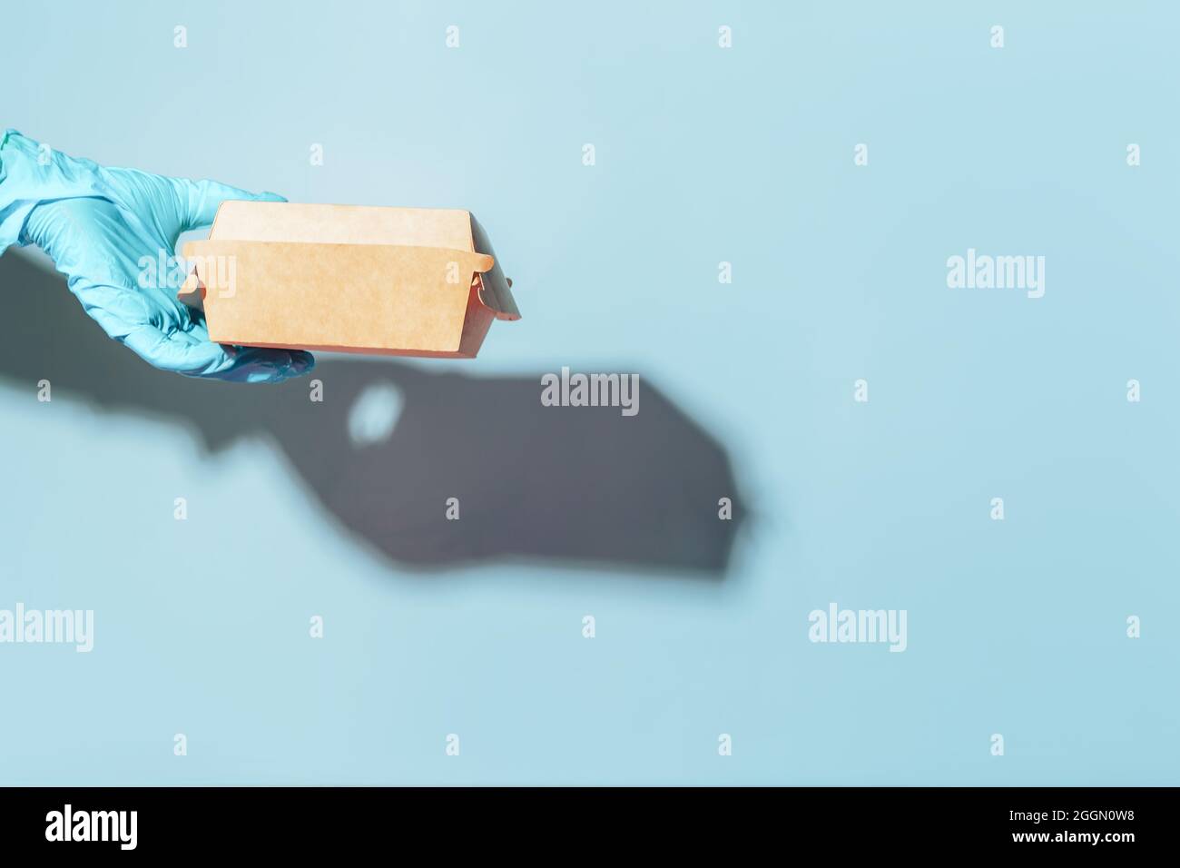Hand blue shipping container hi-res stock photography and images - Alamy