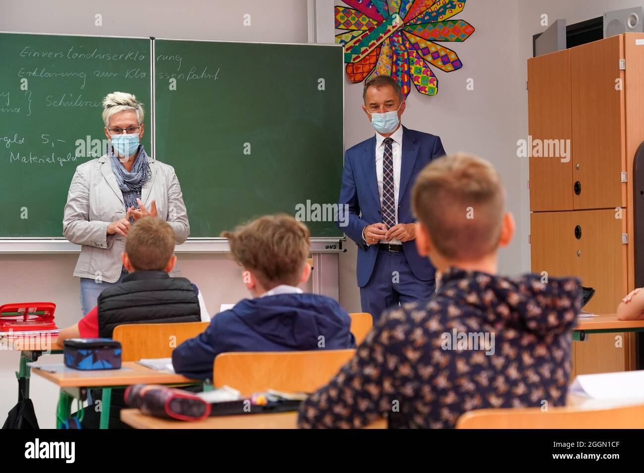 Halle, Germany. 02nd Sep, 2021. At the start of the 2021/2022 school year,  Saxony-Anhalt's Minister of Education Marco Tullner (r., CDU) and former  Olympic javelin champion (1992) Silke Renk-Lange visit a 6th