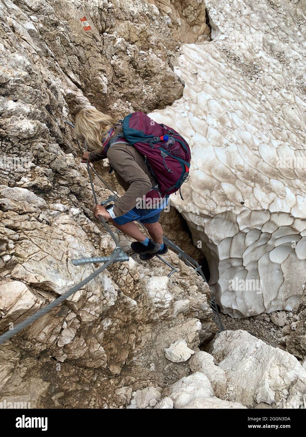 Hiker descending from the mountain Stock Photo - Alamy