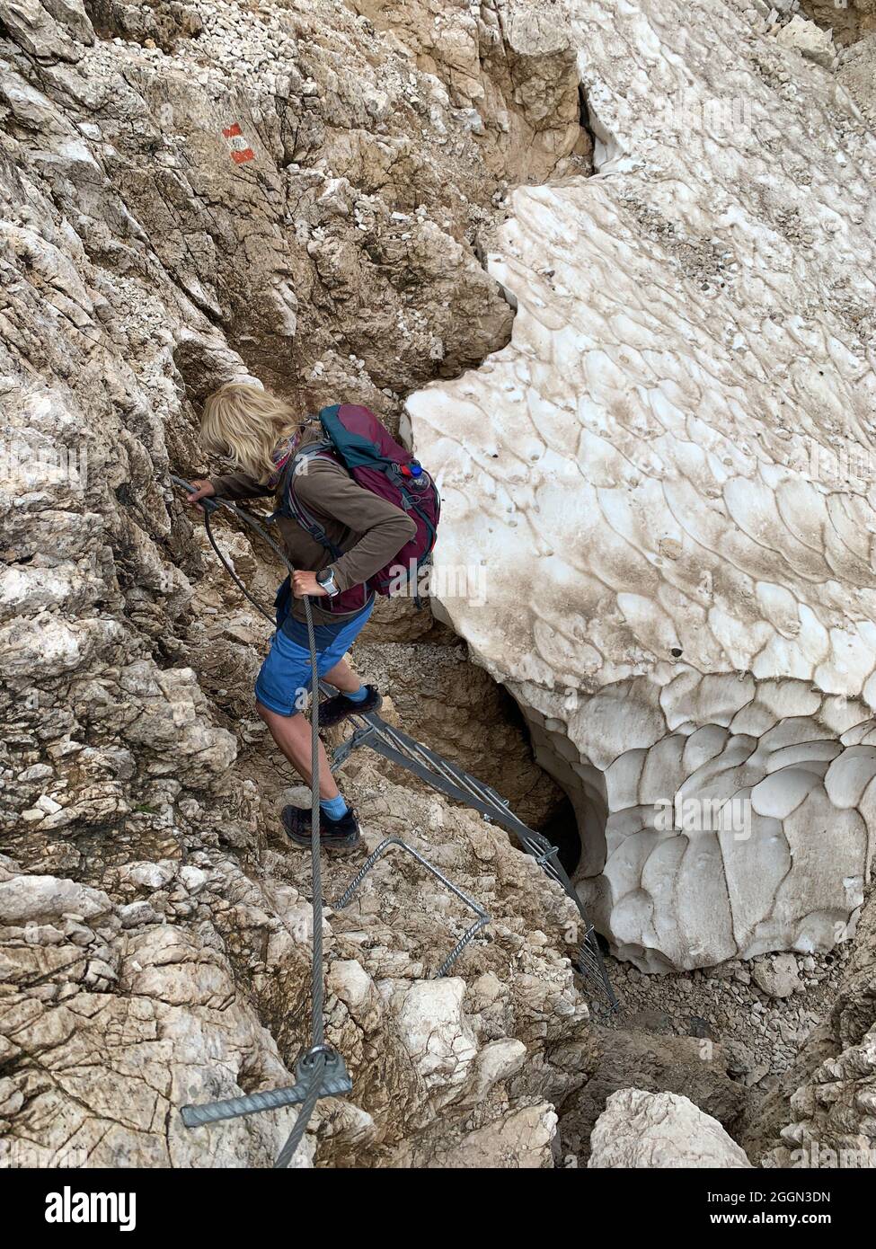 Hiker descending from the mountain Stock Photo - Alamy