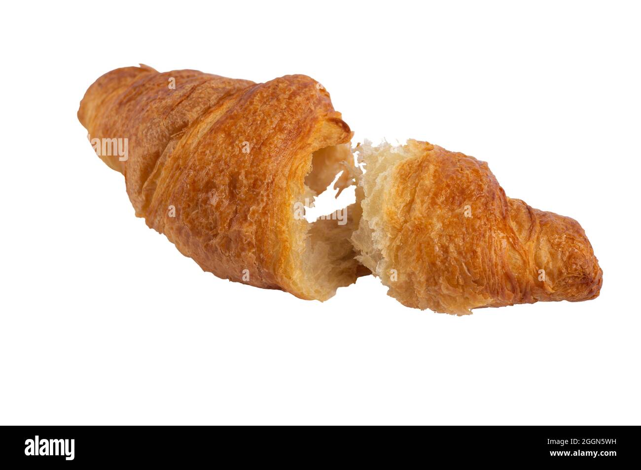 Freshly baked broken croissant isolated on white background. Stock Photo