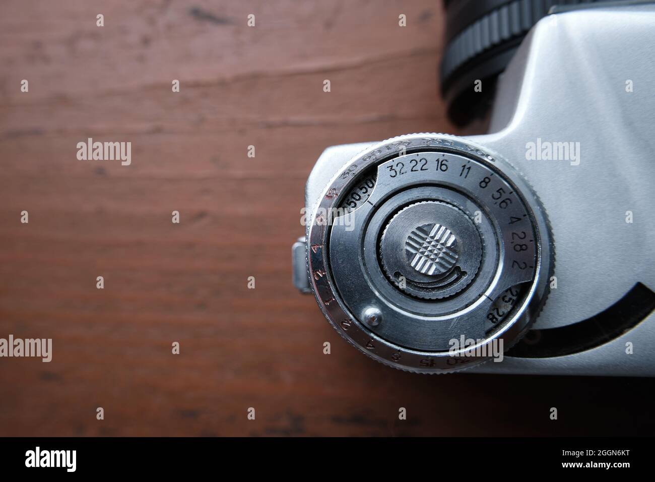 Old vintage 35 mm metal film camera, close-up. The exposure wheel is a close-up. Space for the text. Stock Photo
