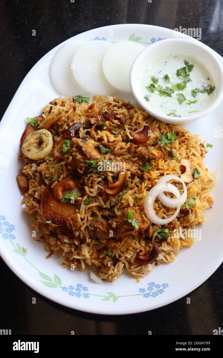 Chicken Biryani or murgh Pulao. Garnished with fried onion, cashews, and coriander. Biryani is a famous Spicy nonvegetarian dish of India. Stock Photo
