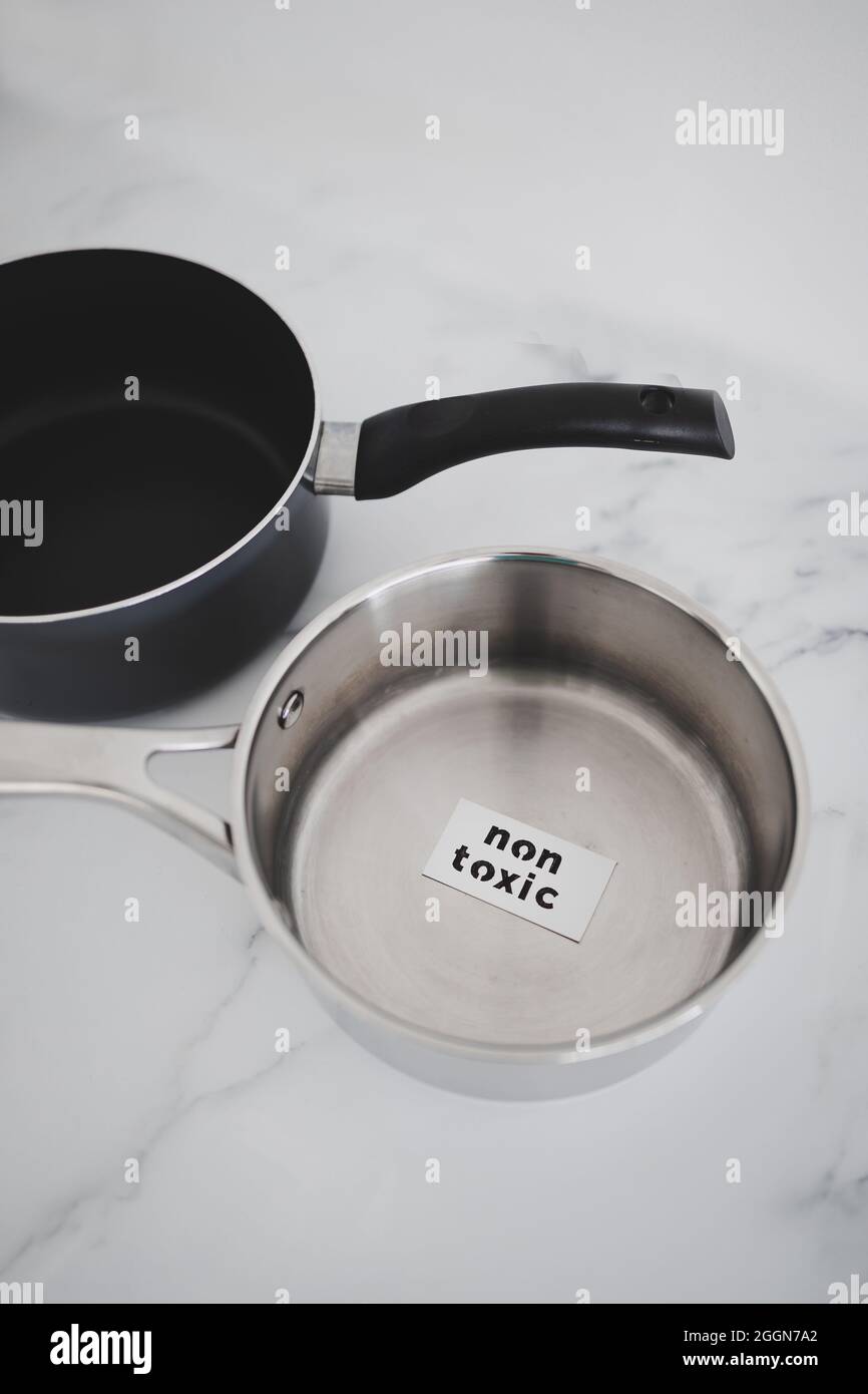 healthy cooking and harsh chemicals concept, stainless steel vs non