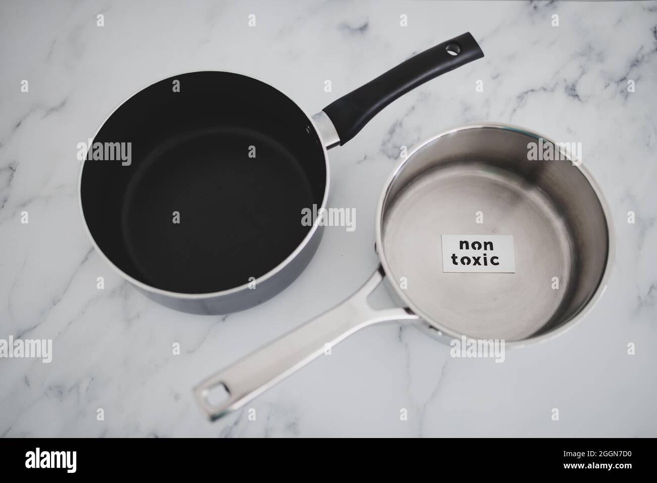 healthy cooking and harsh chemicals concept, stainless steel vs non