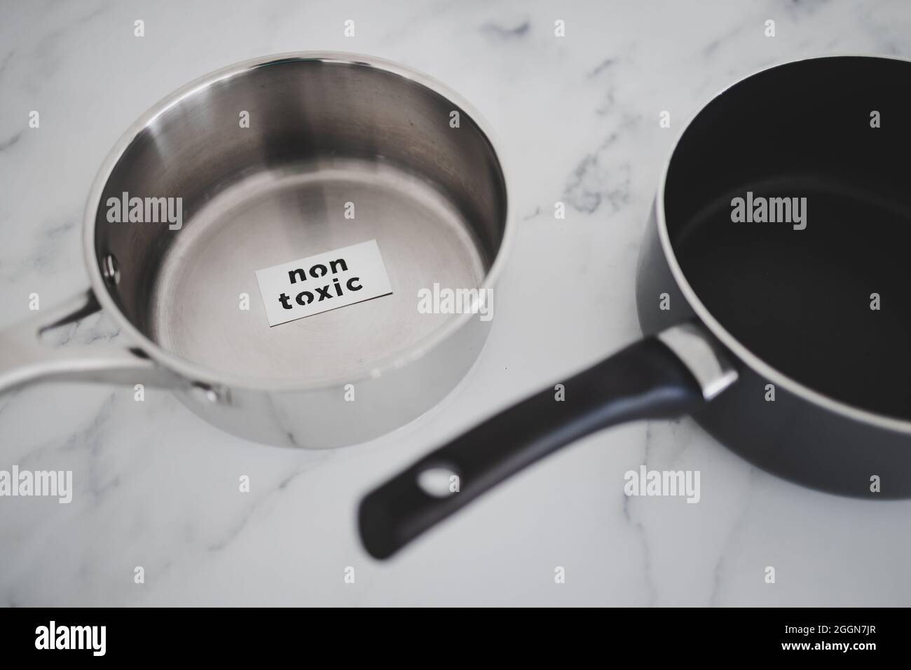 healthy cooking and harsh chemicals concept, stainless steel vs non