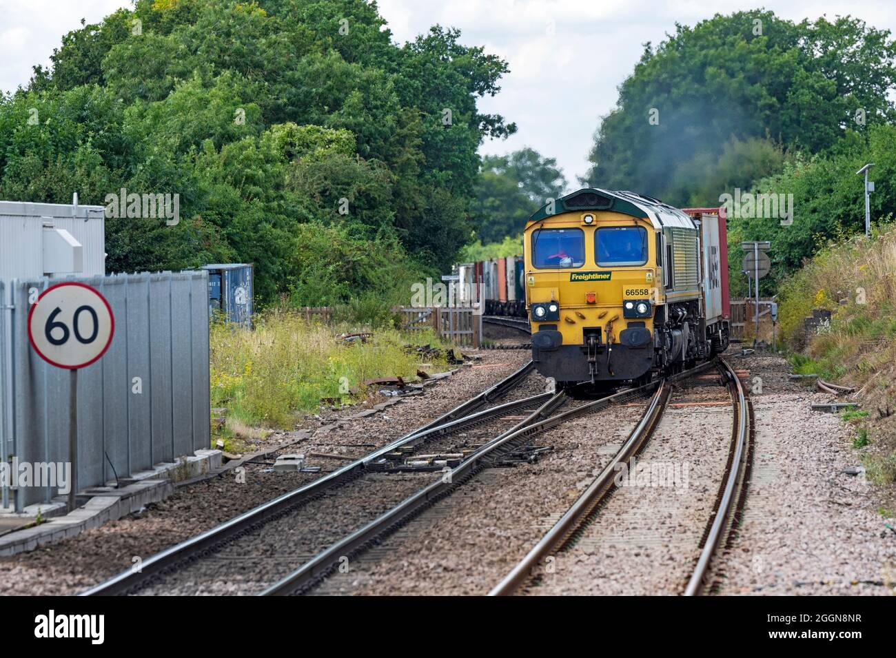 Freightliner freight train on the Ipswich to Felixstowe container port line, Westerfield, Suffolk, UK. Stock Photo