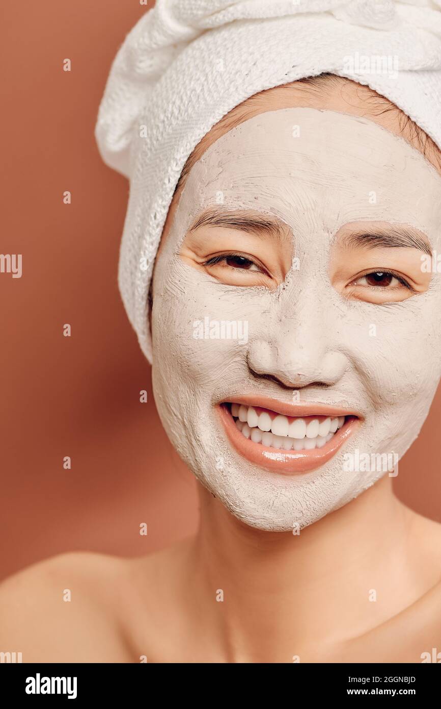 Young Asian woman enjoying of a facial mask treatment Stock Photo Alamy