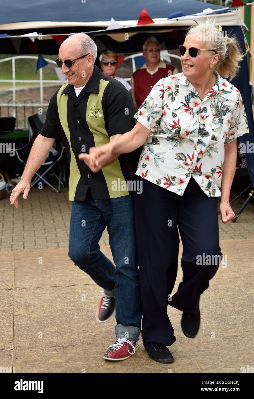 Couple in retro attire dancing during a 50s Weekend at the Watercress Line, Alresford, Hampshire, UK. Stock Photo